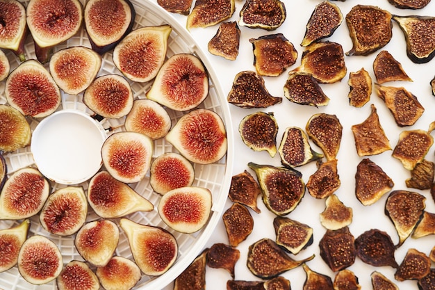 Sliced fresh and dried figs lie on the table top view