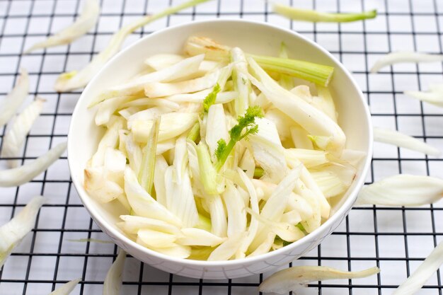 Sliced fresh fennel on white background