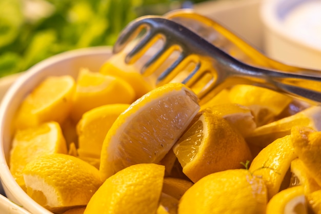 Sliced fresh lemons on plate