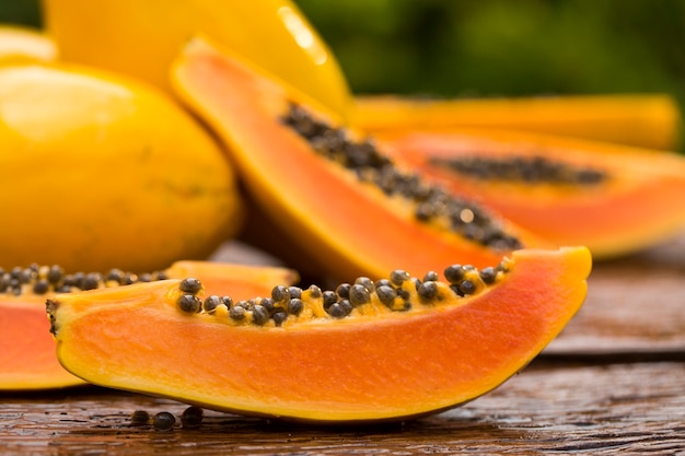 Sliced fresh papaya on wooden table