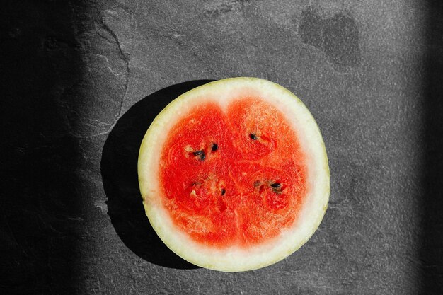 Sliced fresh watermelon isolated on dark background