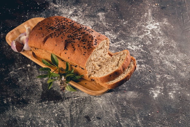 Sliced ​​garlic bread on concrete table