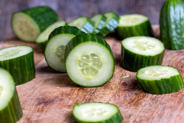 Sliced green cucumber while cooking salad