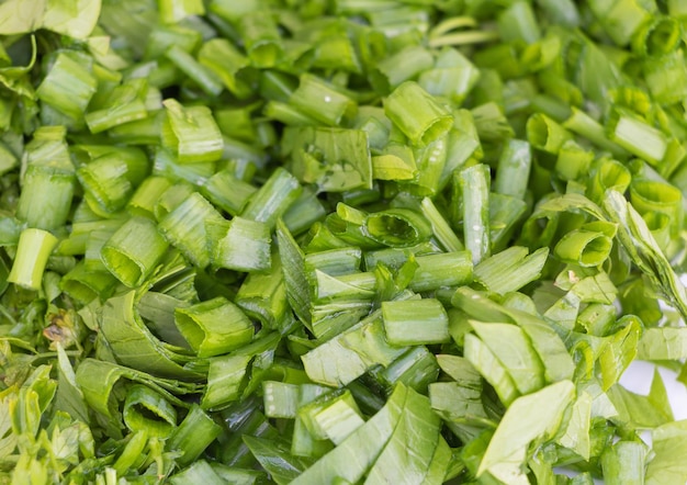 Sliced green onion texture background recipe concept in the process of cooking