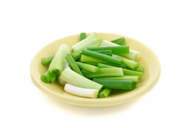 sliced green spring onion in bowl 