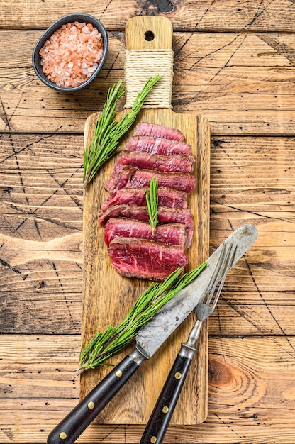 Sliced Grilled fillet mignon steak on a cutting board