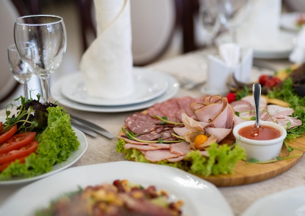 Sliced ham meat sausages on the festive table