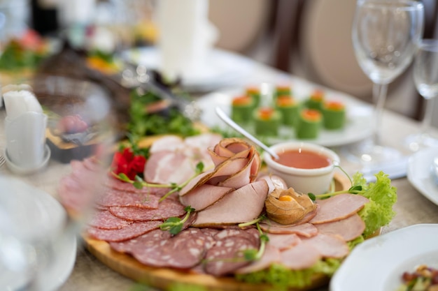 Sliced ham meat sausages on the festive table