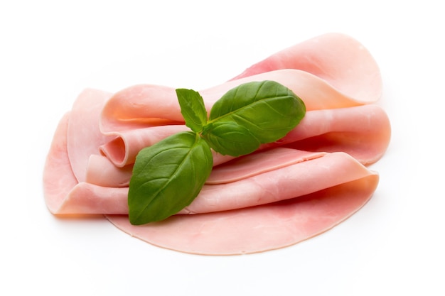 sliced ham on white.fresh prosciutto.pork ham sliced on white.