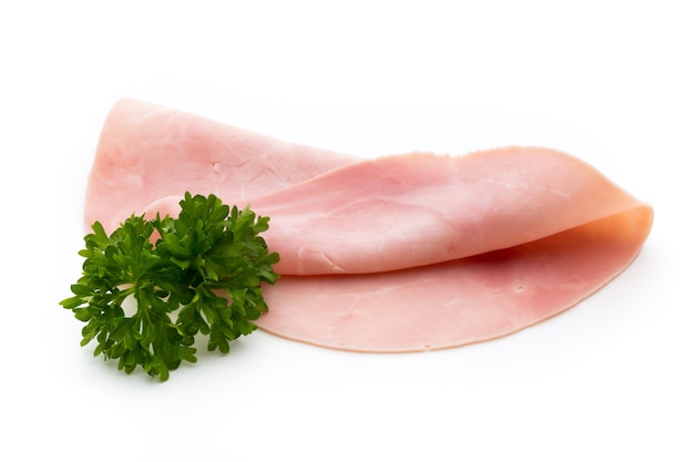 Sliced ham on white surface