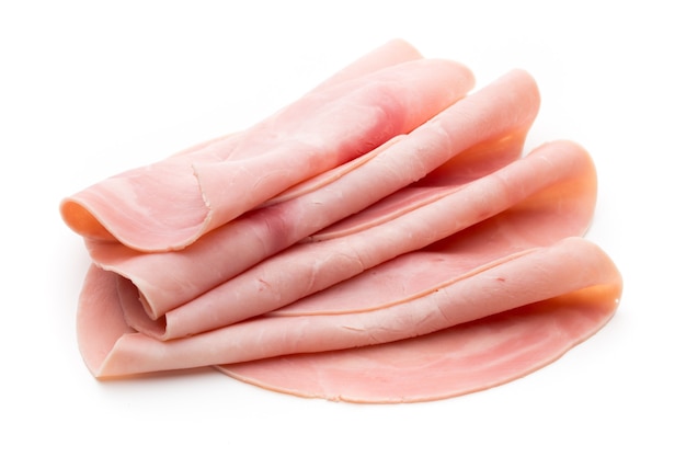 Sliced ham on white surface