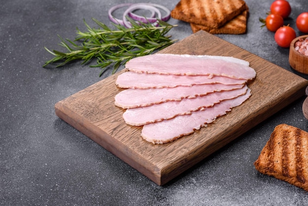 Sliced ham on wooden background Fresh prosciutto Pork ham sliced