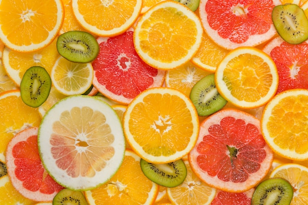 Sliced healthy fruits background