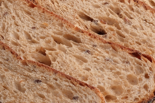 Sliced hearth whole grain bread full screen background