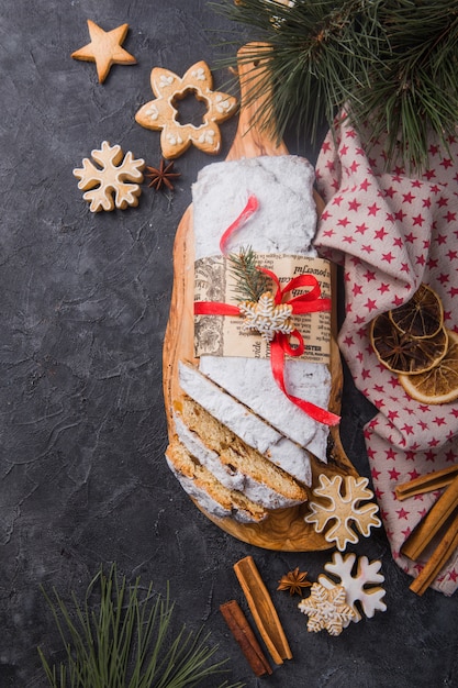 Sliced homemade Christmas stollen with dried berries and nuts