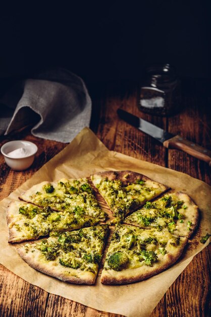 Sliced Italian pizza with broccoli and cheese