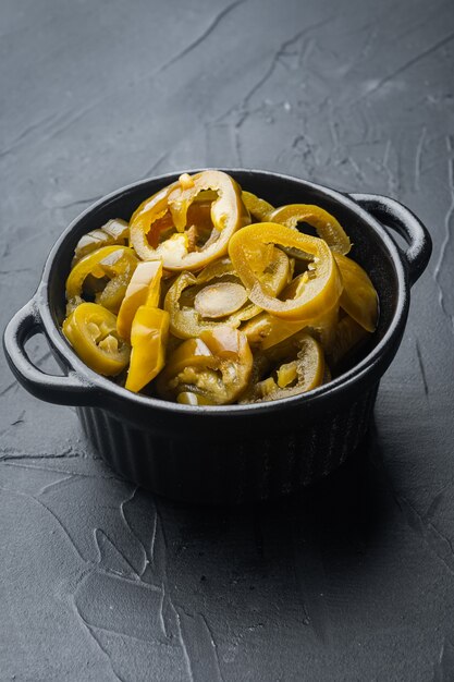 Sliced Jalapeno Peppers in Jars, on black table