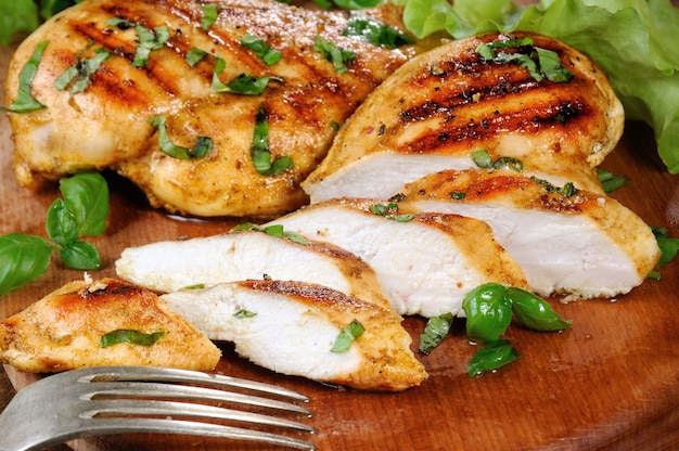 Sliced juicy, tender chicken breast grill close-up.