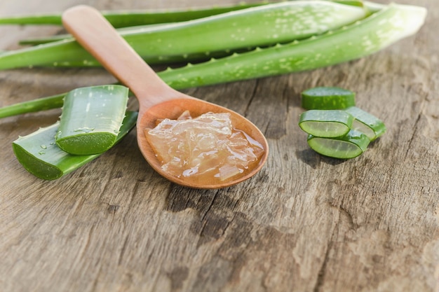 Photo sliced and leaf of fresh aloe vera with aloe vera gel product+