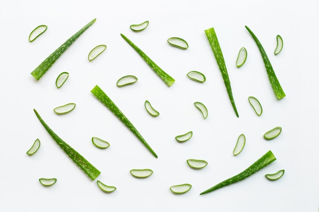 Sliced and leaves of fresh aloe vera on white background.