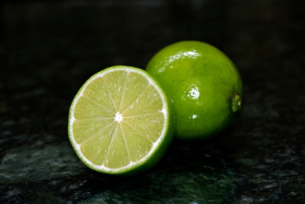 Sliced lemon on black granite