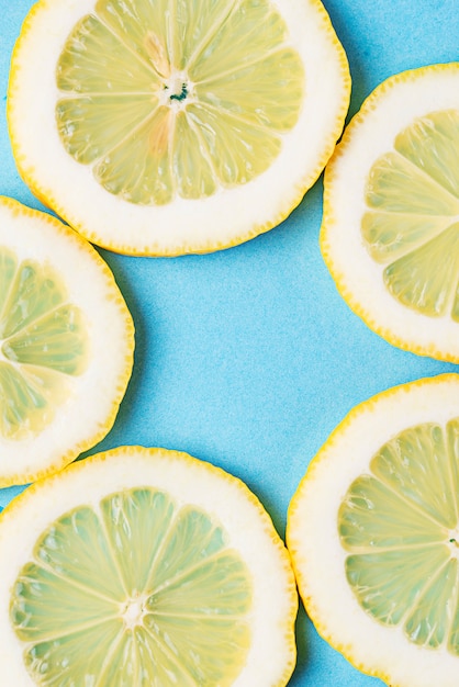 Sliced lemon on blue background