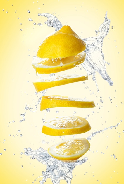 Sliced lemon on yellow wall