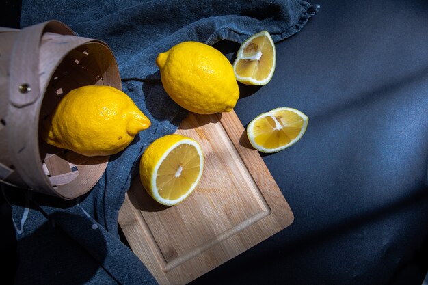 Sliced lemons on cut board flat lay fruits