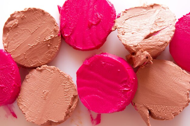 Sliced lipstick sample on white background flat lay Image