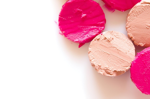 Sliced lipstick sample on white background flat lay Image