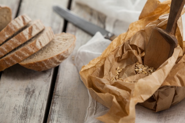 Sliced loaf of bread with knife