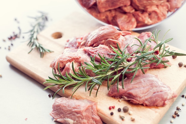 Sliced meat with spices and rosemary