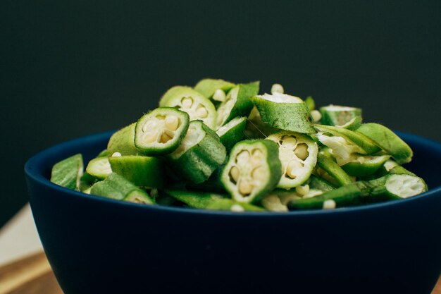 Sliced okra inside a bowl front view nobody