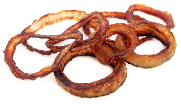 Sliced onion rings over white background