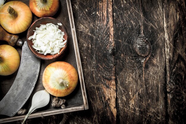 Sliced onions in an old tray