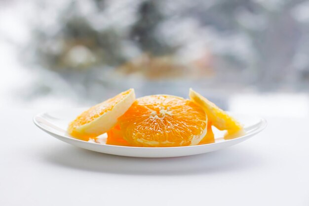 Sliced orange on a whiite plate