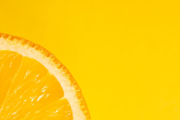 Sliced orange, yellow background