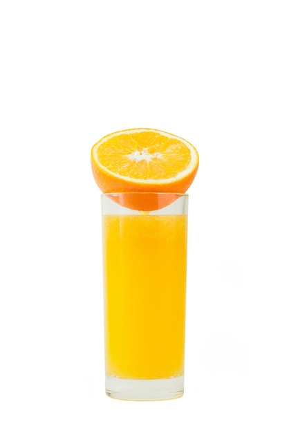 Sliced oranges with a glass of orange juice on a white background