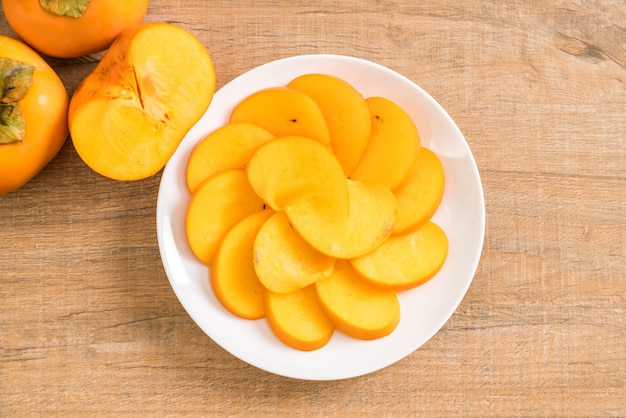 sliced persimmon on plate