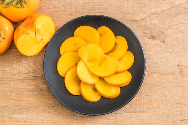 sliced persimmon on plate