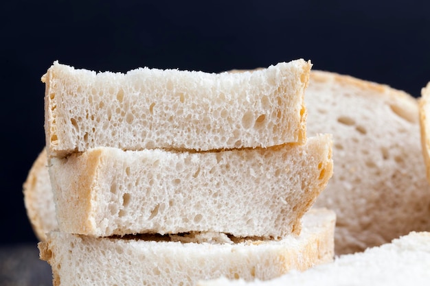 Sliced pieces of gray bread from second-rate flour