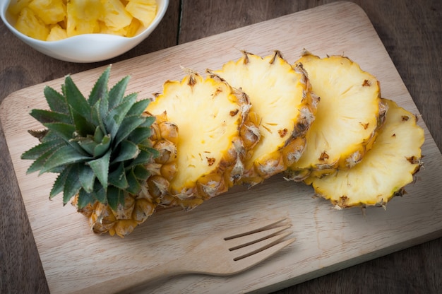 Sliced pine apple on wood table