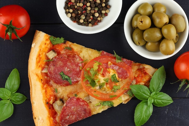 Sliced pizza on the table in the restaurant Italian pizza on wooden table background