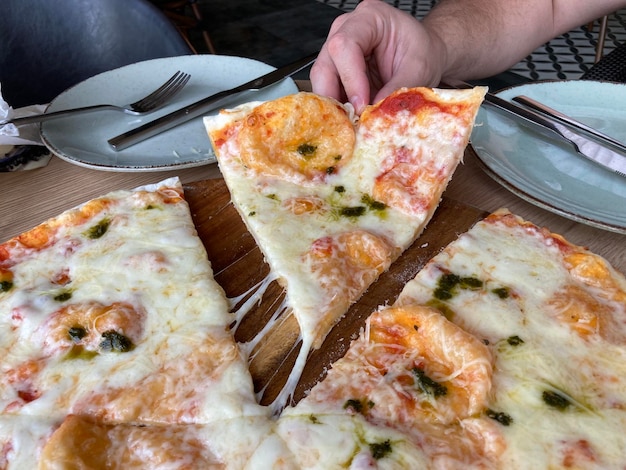 sliced Pizza with Mozzarella cheese, Tomatoes, pepper