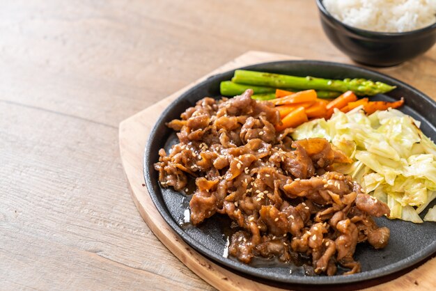 sliced pork steak on hot plate