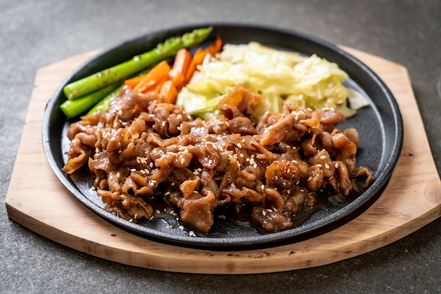 sliced pork steak on hot plate 