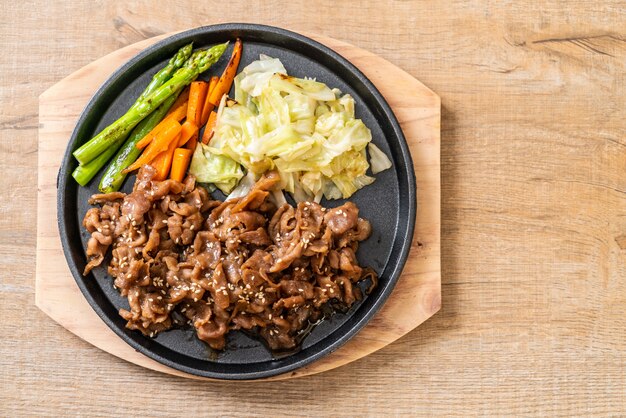 sliced pork steak on hot plate 