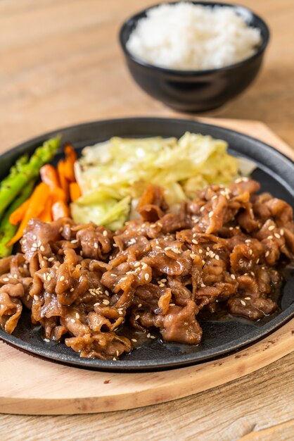 sliced pork steak on hot plate 