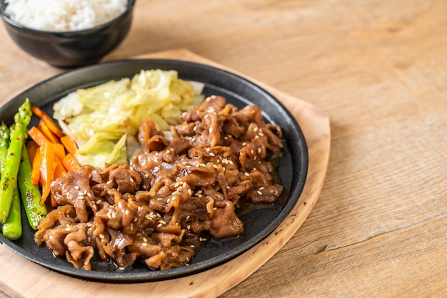 sliced pork steak on hot plate 