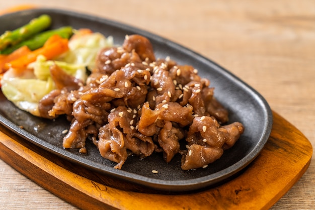 sliced pork steak on hot plate 